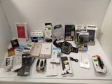 a lot of electronic items on a white table