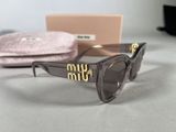 the sunglasses are on the table next to a pink case