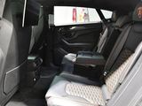 a view of the back seat of a car with the door open
