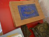 a blue sign on a wooden box on a red table