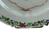 a white plate with a floral design on it
