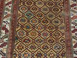 an old rug with many different colors and patterns on it