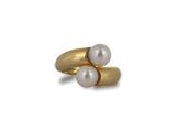an image of a gold ring with two pearls on it