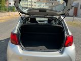 the back of a car with its trunk open on the road