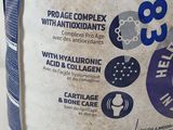 a close up of a bag of dog food on a table