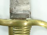 a close up of a sword with a metal handle