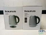 two boxes of two electric kettles sitting next to each other on a table