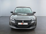 the front of a silver car with a number plate on it