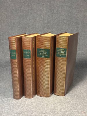 three books sitting on top of a table next to each other