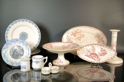 many different types of plates and cups on the table