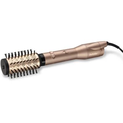 un gros plan d'une brosse à cheveux sur fond blanc