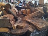 a large pile of wood in a black bag