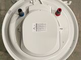 an overhead view of a toilet with the lid up