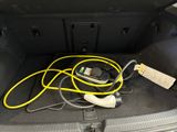 a car trunk with a bunch of wires in it