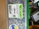 a box full of screws and screws on a table