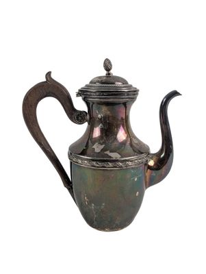 an old silver tea pot with a handle and a handle