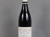 a bottle of wine that is sitting on a table