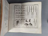 an open book with a drawing of a mountain range