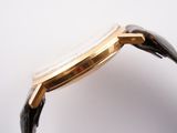 an image of a close up of a watch on a white surface