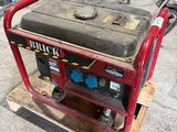 a small generator sitting on a pallet in a garage