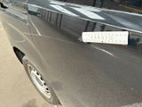 a black van with a sticker on the side of it