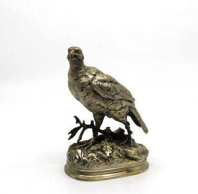 figurine en bronze représentant un oiseau perché sur une branche