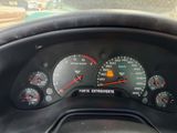 a close up of a car dashboard with a speedometer and gauges