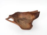 an image of a wooden bowl on a white surface