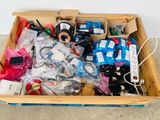 a wooden box filled with assorted electronics and wires