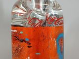 a bottle of soda that has a lot of soda in it