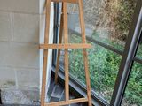 a ladder leaning against a wall next to a window