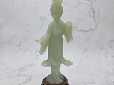 chinese jade figurine of a lady holding a flower