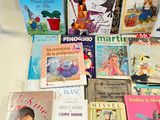 a lot of children ' s books that are on the table