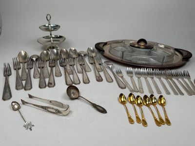 a lot of silverware and silverware on the table