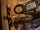 a statue of jesus on a wooden cross on a table