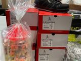 a bag of candy and a bag of shoes on a table
