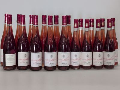 many bottles of wine lined up on a table