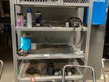 a metal shelf with many items on it in a garage