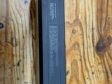 a remote control sitting on top of a wooden table