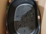 a clock in a box that is sitting on the floor
