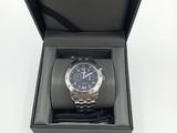 an image of a watch in a black box on a white surface