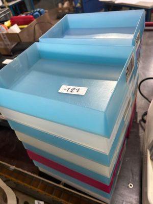 a lot of boxes that are stacked up on a table