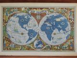 painting of a map of the world in a wooden frame