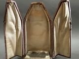 a small open case with a mirror inside of it