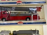 three different types of toy fire trucks in the package