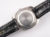 a close up of a wrist watch on a white surface