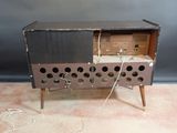 an old radio that is sitting on top of a table