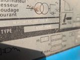 a close up of a sign on the side of a blue machine