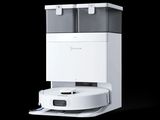 a white and gray machine that is on a black background