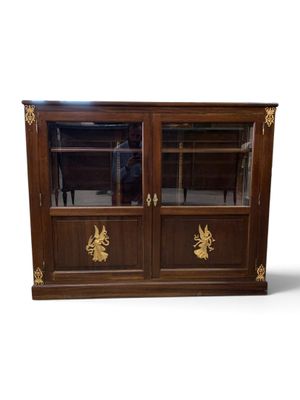 an image of a wooden cabinet with glass doors